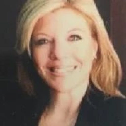 Alison Bordelon is a Caucasian woman. She has long hair.