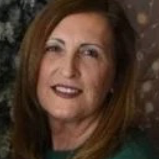 Angela Faulk is a Caucasian woman. She has middle-length hair.