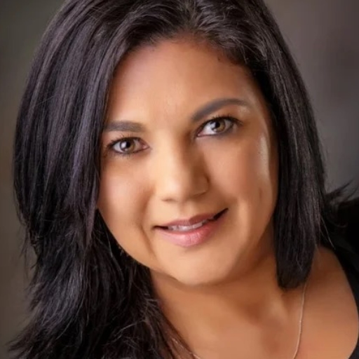 Roxanna Foret is a Caucasian woman. She has middle-length hair.