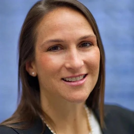 Tamara Jacobson is a Caucasian woman. She has long hair.