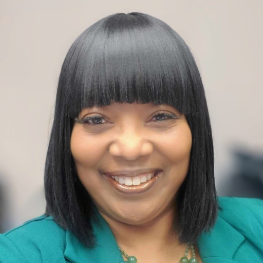 LeTricia L Burns is an African-American woman. Her head is turned to the side. She has her hair worn at the top of her head, and wearing small, dangling ear rings.